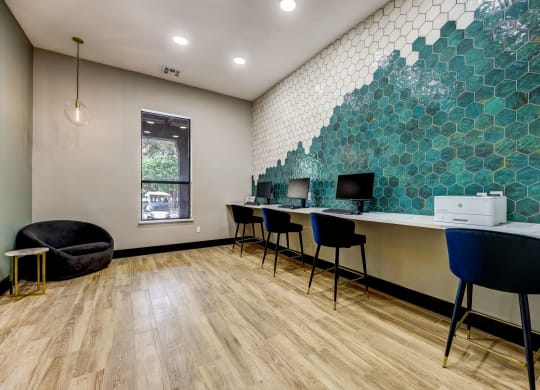 an office with desks and chairs and a wall with green tiles at Ventana Oaks Apartments, Austin, 78717
