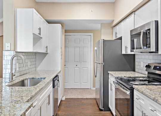 Kitchen With Custom Cabinetry  at Stone Oak @ Parmer, Austin, Texas