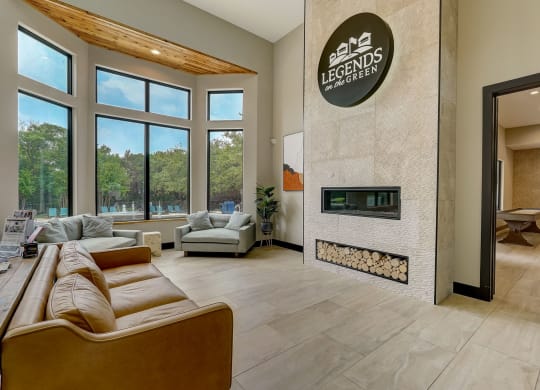 the living room has a fireplace and a large window