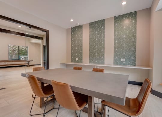 a conference room with a large table and chairs