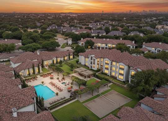 A large house with a pool surrounded by a fence.
