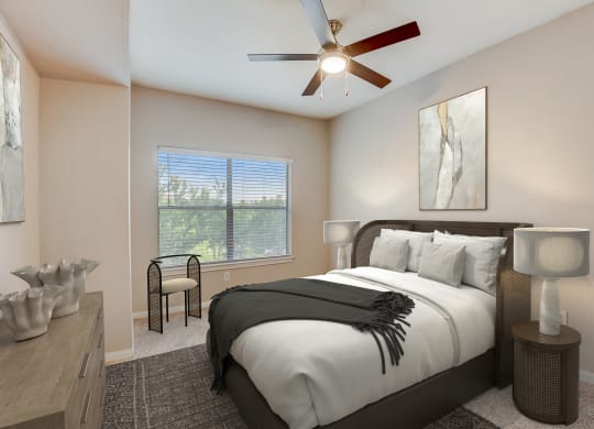 a bedroom with a large bed and a ceiling fan at Artisan Apartments & Shops, Texas, 78729