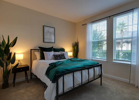Bedroom with a Nightstands at The Oasis at Town Center Apartments, Jacksonville