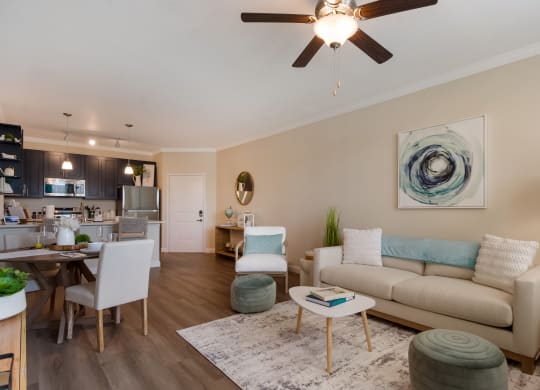 a living room with a ceiling fan and hardwood floors  at The Oasis at Manatee River, Bradenton, FL, 34211