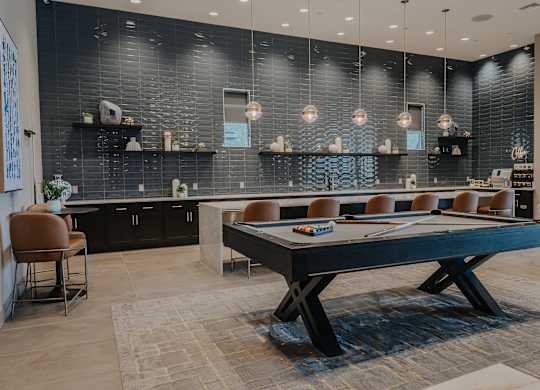 Clubhouse with kitchen area and pool table at Level 25 at The Curve by Picerne, Las Vegas, 89148