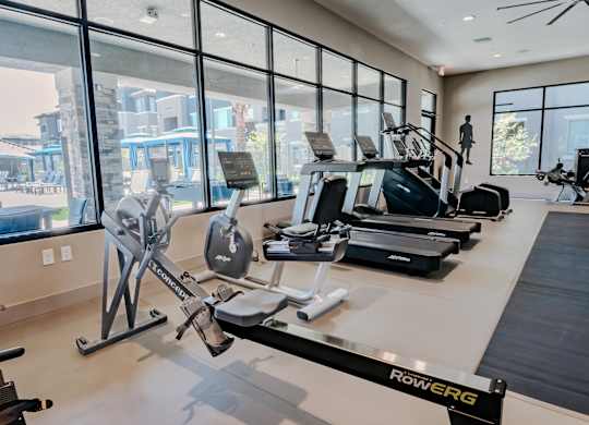 Gym with a variety of cardio equipment including a rowing machine at Level 25 at The Curve by Picerne, Las Vegas, 89148