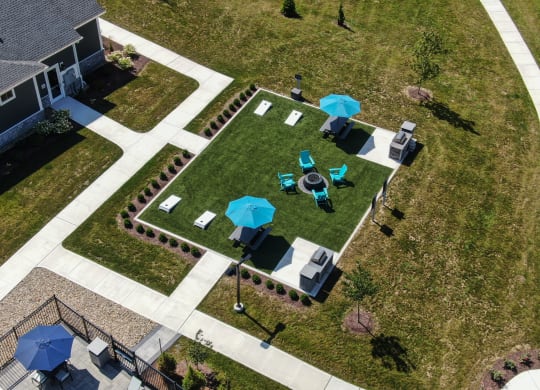 an aerial view of a yard with tables and umbrellas at The Oasis at Plymouth, Massachusetts