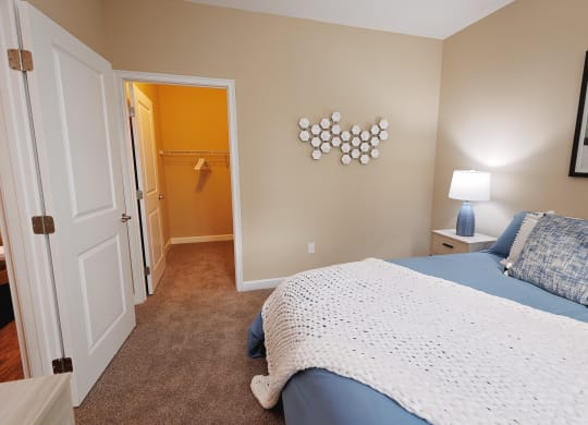 a bedroom with a bed and a door to a bathroom at The Oasis at Moss Park, Orlando, FL
