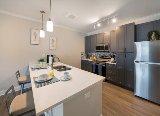 a kitchen with stainless steel appliances and a white counter top at The Oasis at Plymouth, Massachusetts, 02360