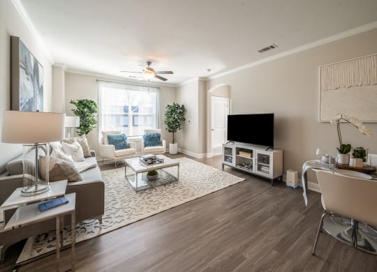 a living room with a couch and a tv  at The Oasis at Plymouth, Plymouth, MA