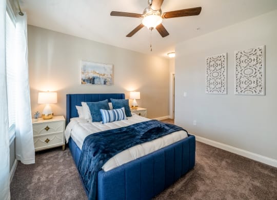 a bedroom with a bed and a ceiling fan at The Oasis at Plymouth, Plymouth, MA, 02360