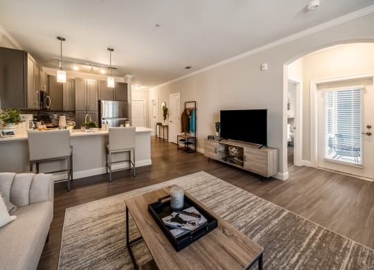 a living room and kitchen with a couch and a table at The Oasis at Plymouth, Massachusetts