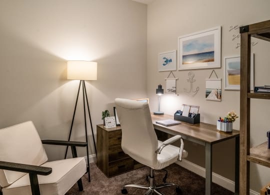 a home office with a desk and chair and a lamp at The Oasis at Plymouth, Massachusetts