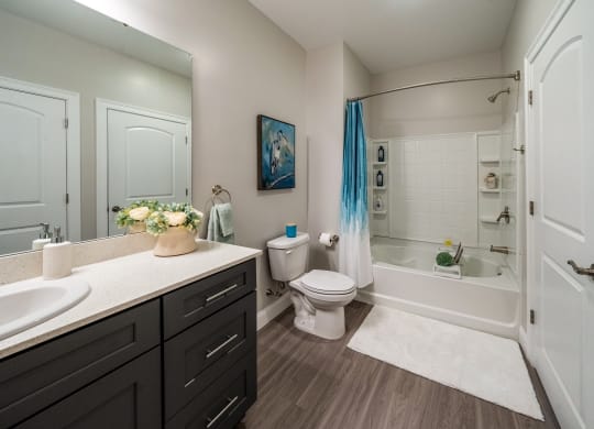 a bathroom with a toilet and a shower and a sink  at The Oasis at Plymouth, Plymouth, MA