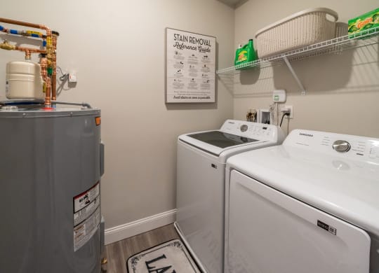 the laundry room has a washer and dryer and a refrigerator at The Oasis at Plymouth, Plymouth, MA, 02360
