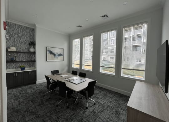 a room with a table and chairs and a wall of windows at Plymouth, Plymouth, MA, 02360