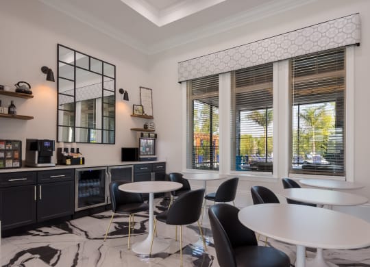 a room filled with furniture and a large window  at The Oasis at Manatee River, Bradenton, FL, 34211