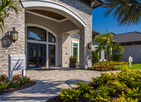 a home with a paver walkway leading to the front door  at The Oasis at Manatee River, Bradenton, FL