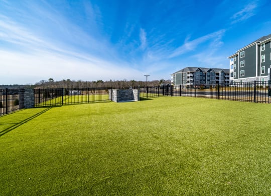 a large grassy area with a soccer goal in the middle of it at The Oasis at Plymouth, Plymouth, MA