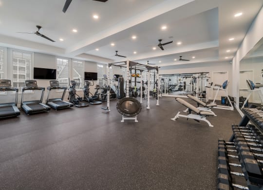 a gym with treadmills and other exercise equipment at The Oasis at Plymouth, Massachusetts