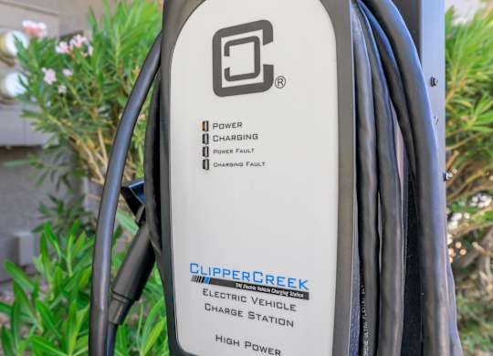 A close up of a Clipper Creek electric vehicle charge station.