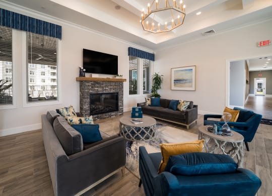 a living room with couches and a fireplace at The Oasis at Plymouth, Plymouth, Massachusetts