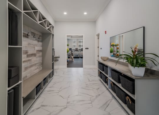 the living room has a marble floor and a large counter with a plant at The Oasis at Plymouth, Massachusetts