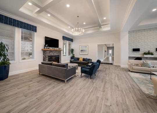 a living room with couches and chairs and a fireplace at The Oasis at Plymouth, Plymouth, MA, 02360