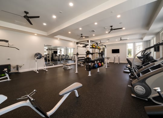a gym with treadmills and other exercise equipment in a home at The Oasis at Plymouth, Plymouth, MA