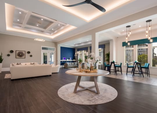 a living room filled with furniture and a large window  at The Oasis at Manatee River, Bradenton, FL