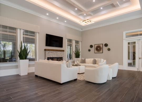 a living room with a coffered ceiling and hardwood flooring  at The Oasis at Manatee River, Bradenton, FL, 34211