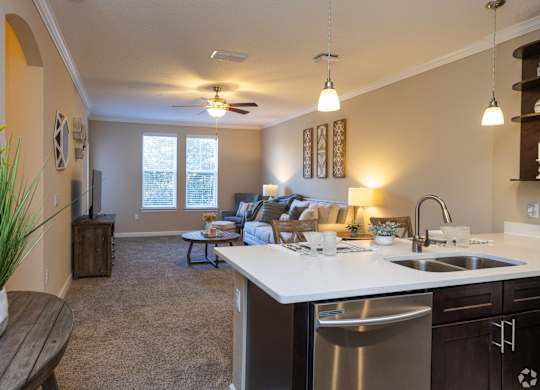 A kitchen with a dining table at The Oasis at Highwoods Preserve, Tampa, FL, 33647 