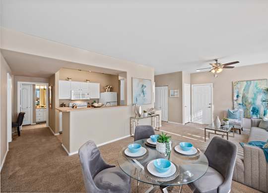 A well-lit, modern living room with a dining table