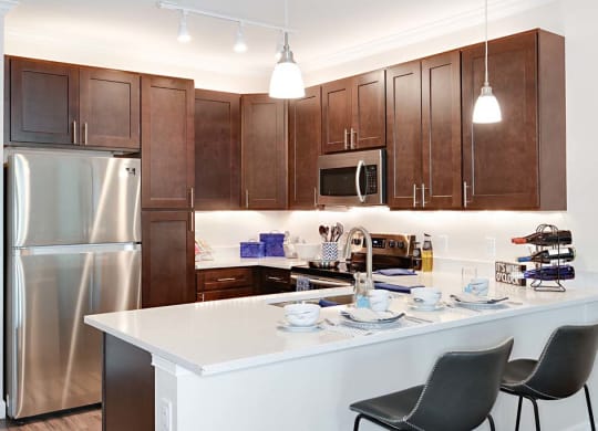 Gourmet Kitchen With Island at The Oasis at Cypress Woods, Fort Myers