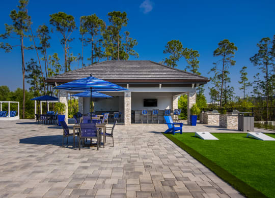 a large pavilion with a seating area and a bar  at The Oasis at Manatee River, Bradenton