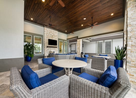 the preserve at ballantyne commons clubhouse with couches and tables at The Oasis at Highwoods Preserve, Florida