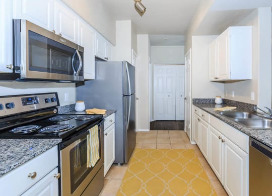 Kitchen appliances and cabinets at The Aliante by Picerne, Arizona, 85259
