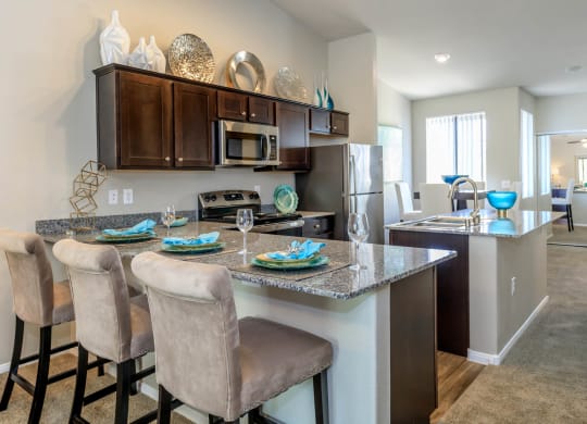 Kitchen wide view with cabinets and appliances at The Cantera by Picerne, Nevada, 89139