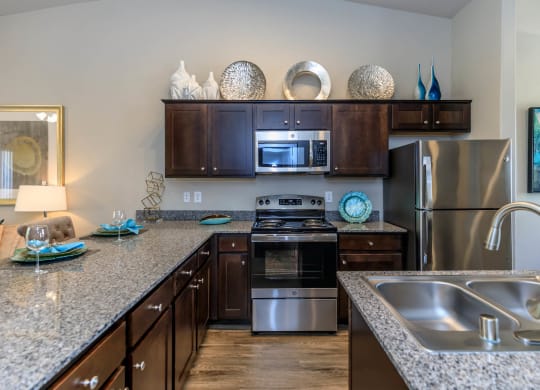 Kitchen wide view with cabinets at The Cantera by Picerne, Nevada