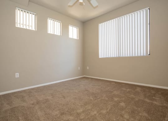 Unfurnished room with wooden floor and ceiling fan1 at The Cantera by Picerne, Las Vegas