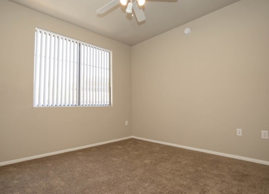 Unfurnished room with wooden floor and ceiling fan at The Cantera by Picerne, Las Vegas, Nevada