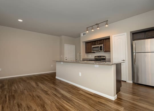 wooden cabinets and appliances in kitchen and dining area1 at The Cantera by Picerne, Las Vegas, 89139