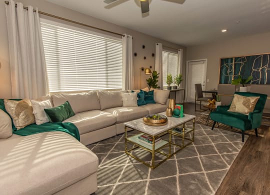 Living room with couch and cushions at Level 25 at Cactus by Picerne, Las Vegas