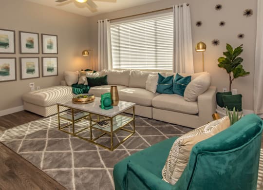 Livng room with couch and frames at Level 25 at Cactus by Picerne, Las Vegas, NV, 89141
