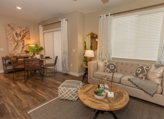 Living room with couch and center table at Level 25 at Cactus by Picerne, Las Vegas