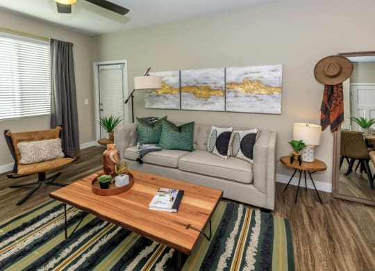 Living room decor with couch and frames along with center table1 at Level 25 at Sunset by Picerne, Las Vegas, Nevada