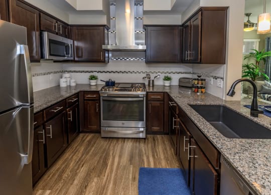 Kitchen with wooden cabinets1 at Level 25 at Sunset by Picerne, Nevada, 89113