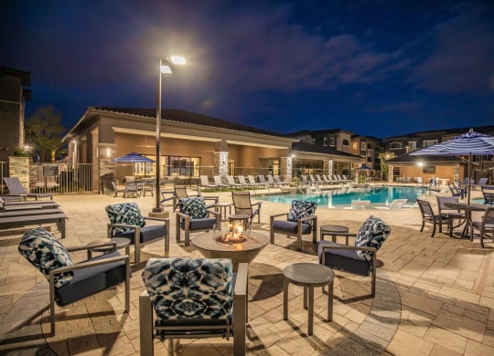 Pool side patio and sundeck at night at Level 25 at Sunset by Picerne, Nevada