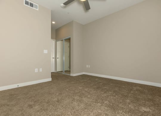 Wooden flooring and ceiling fan and light at Level 25 at Sunset by Picerne, Las Vegas