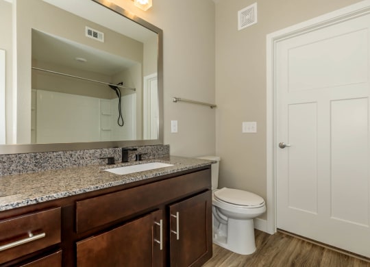 Bath with wooden floor at Level 25 at Sunset by Picerne, Nevada, 89113